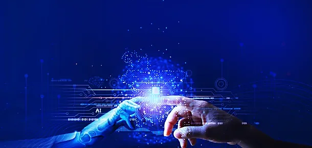Mano humana y mano robótica representando los límites de la inteligencia artificial y la relación entre tecnología y humanidad.